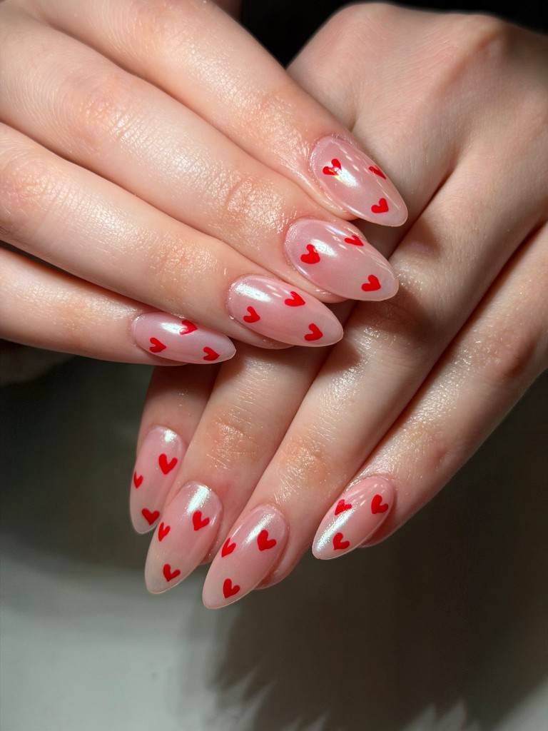 Pink builder gel nails with red hearts in Miami